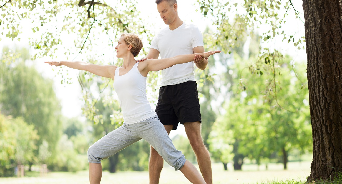 Couple performing yoga